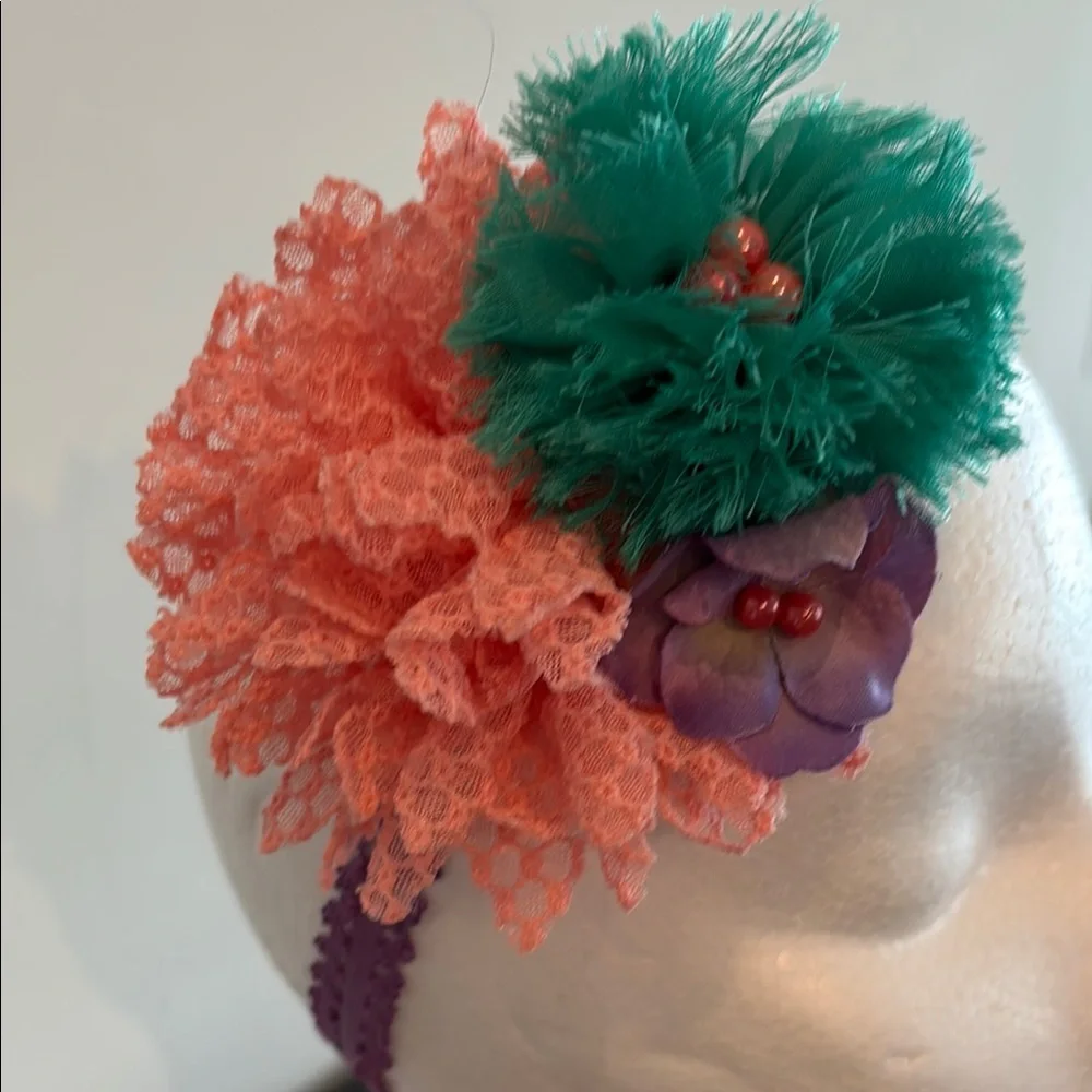 Green and Pink Floral Hair Accessory with Pom-Pom Design